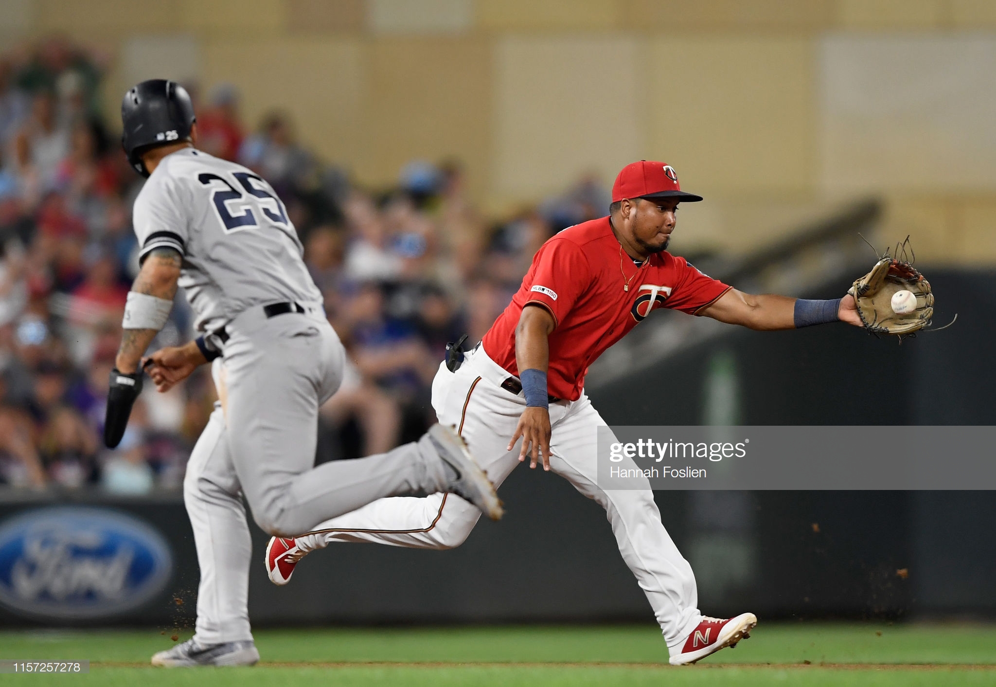 MINNEAPOLIS, MN - JULY 22: Gleyber Torres #25 of the New York Yankees runs to third base as Luis Arraez #2 of the Minnesota Twins fields the ball hit by Gio Urshela #29 of the New York Yankees during the sixth inning of the game on July 22, 2019 at Target Field in Minneapolis, Minnesota. (Photo by Hannah Foslien/Getty Images)