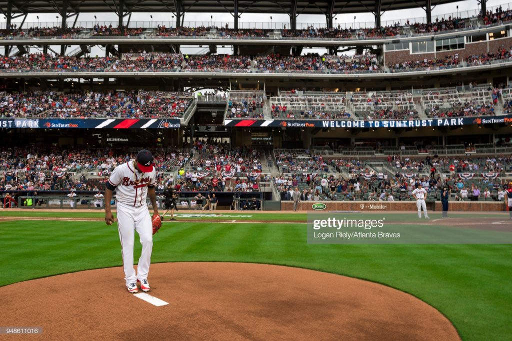 ATLANTA, GA - MARCH 29: Julio Teheran #49 of the Atlanta Braves throws out the first pitch against the Philadelphia Phillies on Opening Day at SunTrust Park on March 29, 2018, in Atlanta, Georgia. (Photo by Logan Riely/Beam Imagination/Atlanta Braves/Getty Images) *** Local Caption *** Julio Teheran