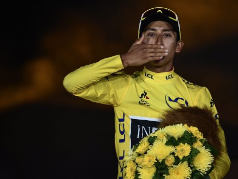 Colombia's Egan Bernal celebrates his overall leader's yellow jersey on the podium of the 21st and last stage of the 106th edition of the Tour de France cycling race between Rambouillet and Paris Champs-Elysees, in Paris on July 28, 2019. / AFP / Anne-Christine POUJOULAT