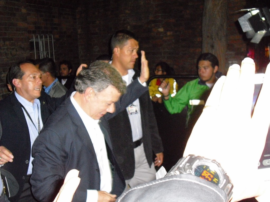President Juan Manuel Santos makes his way home after his re-election victory speech.