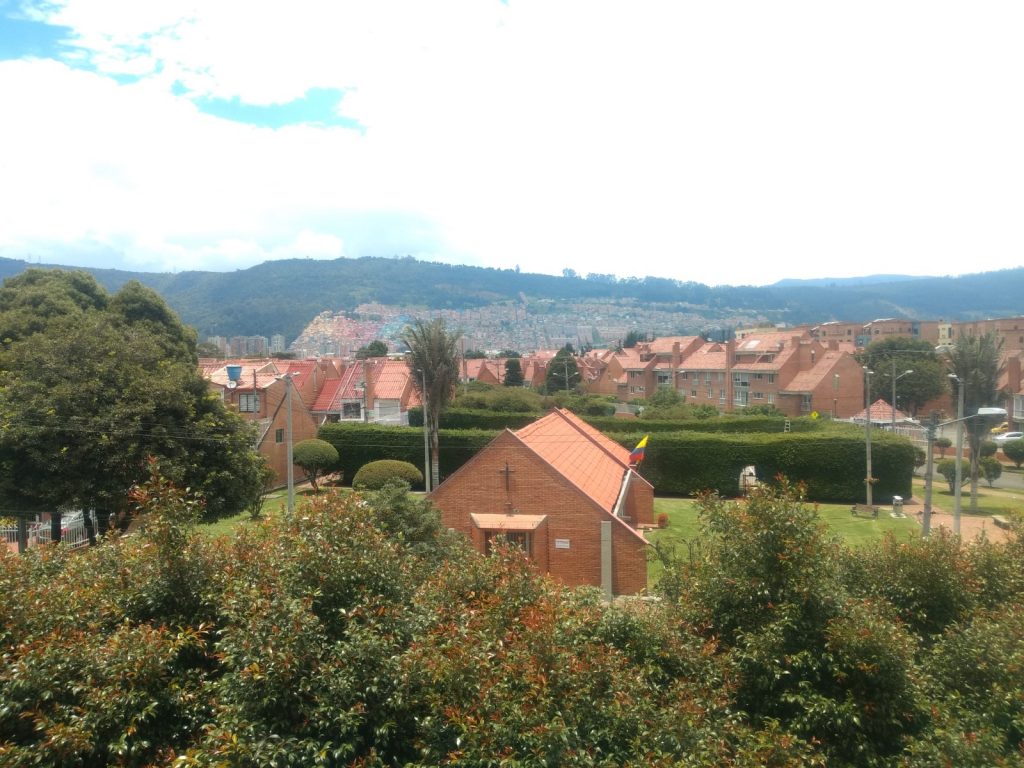 A view of a plush north Bogotá housing estate with a poorer neighbourhood in the background.