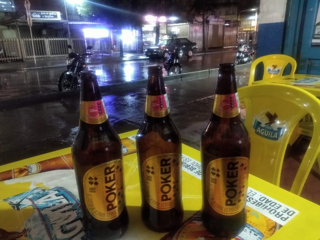 The odd Poker beer doesn't do too much harm, does it? (Photo shows three litre bottles of Poker on a table in a tienda bar in Verbenal, Bogotá, Colombia.)
